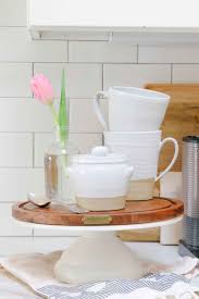 Place the cake home plate layon and other pieces as shown in the image. Decorating Cake Stands 4 Ways That Don T Involve Cake Modern Glam