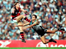 Aussie Rules Football Not Many Rules And A Cross Between Rugby And Other Sports It Is Fast Uncompromising Essendon Football Club Australian Rules James Hird