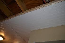 Basement Ceiling Installation Blogger Says They Used Liquid Nail On The Floor Joists Ceiling Tiles Basement Basement Ceiling Ceiling Installation