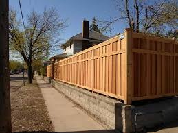 Aesthetically, stockade fencing is a solid choice for colonial style homes. Keller Residential St Paul Minneapolis Mn