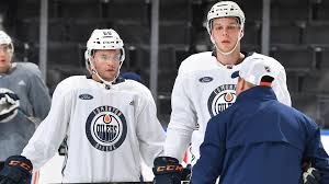 release oilers make roster moves