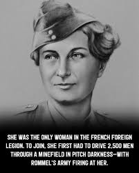 Florence Conrad (R), head of the “Rochambelles” French Women's Ambulance  Corps, stands with members of her unit in front of a new jeep & ambulances  provided by the USA in Rabat Morocco -