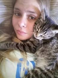 She was a scared feral in the backyard when I moved in. Now she's a very  comfy, cuddly, spoiled indoor girly!