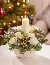 Christmas White Candle Arrangement Flowers With Images Christmas Flower Arrangements Christmas Candle Decorations Christmas Floral Arrangements