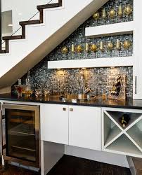 Dunham design company pantry makeover under stairs. 8 Clever Ways To Utilize That Awkward Space Under Your Stairs