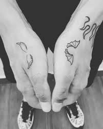 Small tattoo of a happy face with female fingers. Top 91 Best Angel Wings Tattoo Ideas 2021 Inspiration Guide