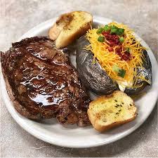 Remove the steaks from the marinade and season with the salt and pepper. 14 Ounce Rib Eye Steak With A Loaded Baked Potato Picture Of Brewster S Restaurant Chalmette Tripadvisor