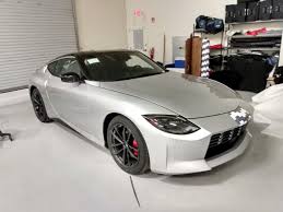 A camouflaged nissan z in final production form is caught testing on the streets of colorado wearing just a body wrap. 2022 Nissan Z Caught Again Undisguised In Production Form With Blue Interior Carscoops
