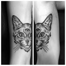 As with all tattoos, cat tattoos became common as people wanted to have them for the different symbolism they served. Three Eyed Cat Tattoo By Rory Pickersgill From Dragon Tattoo Eindhoven Cat Tattoo Cattattoo Rorypickersgill Dragont Cat Tattoo Tattoos Third Eye Tattoos