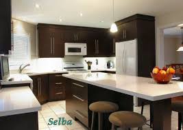 Dark brown kitchen cabinets with white countertops. Pin On New House Kitchen