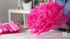 Tissue paper pom pom flowers are a whimsical and economical way to decorate for your wedding. How To Make Tissue Paper Pom Poms Better Homes Gardens