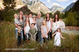 A husband and wife photography team that's passionate about capturing photos of love stories outdoors, whether that's in the mountains and deserts. Family Portrait In Ouray Co By Durango Photographers Durango Photography By Karen Skelly Photography