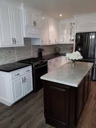 Modern design kitchen with 2 color kitchen cabinets. Black Countertop White Cabinets Expresso Island Arctic White Granite Kitche Arctic White Cabinets Black Countertops Kitchen Design Kitchen Remodel