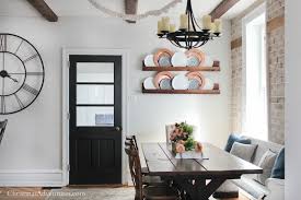 Reclaimed barn door in the dining room hides a large shelf [from: Dining Refresh Our Painted Interior Door Christina Maria Blog Doors Interior Painted Interior Doors Interior