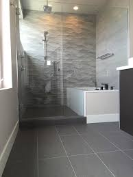 This gray tile bathroom layers subway tile with handpainted tile for an elevated take on new traditional style. Small Gray Bathroom Ideas A Balance Between Style And Space Conscious Design