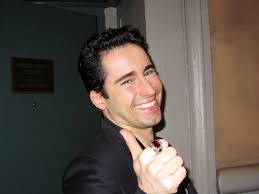 He is preparing his supplies. John Lloyd Young