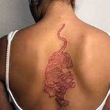 Tiger Tattoo Tattoo Of Tiger On The Girl S Back Tiger Tattoo Back Tattoos Red Ink Tattoos Red Tattoos