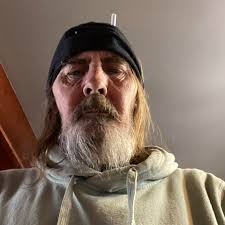 Toronto Argonauts' owners: John Candy, Bruce McNall and Wayne Gretzky  posing with player, Rocket Ismail, in 1991.