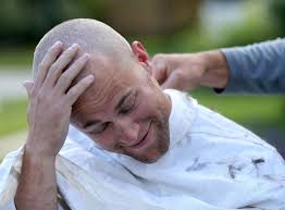 Firefighters shave heads, pay tribute to co-workers fighting cancer