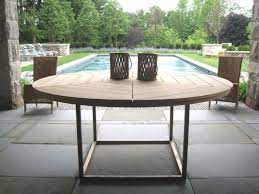 An Outdoor Table Should Be Simple And Well Proportioned Blending Into A Landscape Rather Tha Round Outdoor Dining Table Round Outdoor Table Patio Dining Table