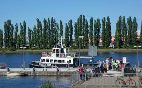 A ferry is a boat that transports passengers and sometimes also vehicles, usually across. Ferries On The Weser River In Bremen