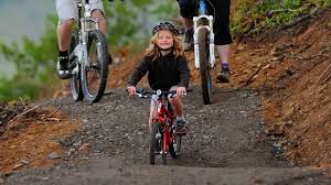 Little Girl Cycling With Her Parents On A Bikepark Wales Trail Cycling Events Wales Mtb
