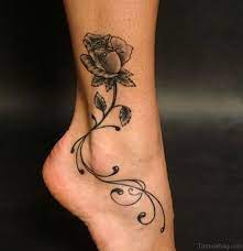Realistic black rosary tattoo on foot and ankle. 41good Looking Rose Tattoos For Ankle