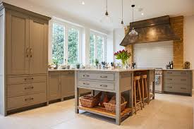 This kitchen island is equipped with 2 deep drawers, a sliding door cabinet with an adjustable shelf, and 2 towel bars. Bespoke Kitchen Project 16 Weybridge The Main Company