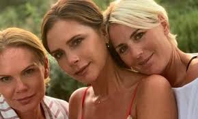 Victoria Beckham poses with her lookalike sister Louise Adams in Italy