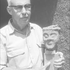 John L. Caskey holding the head of the so-called “Dionysia” (courtesy...