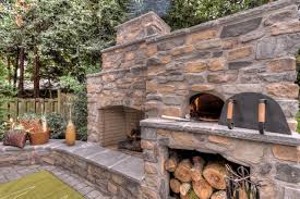A fireplace provides an elegant focal point that visually transforms a patio into an outdoor living room. Cultured Stone Outdoor Fireplaces