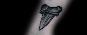 Melanie also has a tooth inked on her left bicep. 40 Shark Tooth Tattoo Designs For Men King Of The Waters