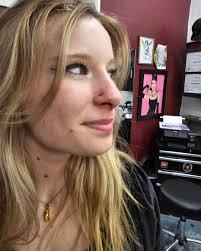 Tattoo shop open daily at 2pm