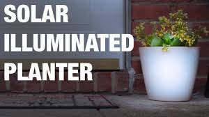 A solar panel is located at the top of the lantern. Solar Illuminated Planter Youtube
