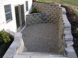 The path to this lower level should be inviting, meaning that since most walkout basements have their light coming from just the downhill side of the home, make. Create A Walkout Basement With Use Of Retaining Walls And A Clever Walkway And Stone Steps This Will Li Walkout Basement Basement Remodeling Basement Entrance