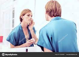 Beautiful young crossdresser in blue bathrobe staying in bathroom Stock  Photo by ©Dmyrto_Z 227285850