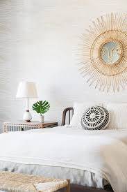 For the last few years, sunburst mirrors have become a décor. Gold Sunburst Mirror Over Brown Wood Bed Transitional Bedroom