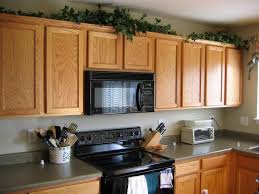 how to decorate above kitchen cabinets