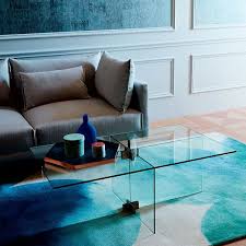 The ample top and open bottom shelf offer stylish serving and storage space. Cosima Glass Coffee Table