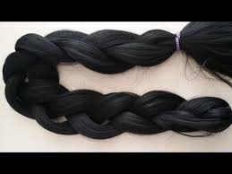 You get the strand of extensions between your thumb and index finger, with the strand in the middle. How To Cut Extensions Braiding Hair Into Different Sections Youtube