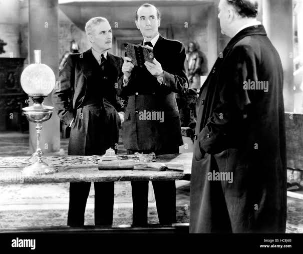 THE TRIUMPH OF SHERLOCK HOLMES, from left, Ian Fleming, Arthur Wontner,  Charles Mortimer, 1935 Stock Photo - Alamy