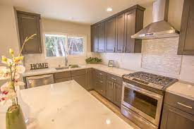 This granite has a creamier background with touches of rose, burnt orange, light brown, and a bit of black. The Perfect Match Kitchen Countertop Ideas With Oak Cabinets Pro Stone Countertops