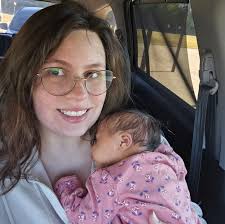 What is the identity of this tall plant under grow light?