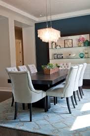 If you find that the traditional style for your living room is too formal, but a contemporary style is a little too minimalist, the transitional style may have all the elements you want when designing your living room. Blue Transitional Dining Room With Eye Catching Chandelier Hgtv