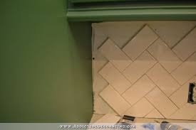 For the first design, we stacked the tile horizontally. How To Install A Herringbone Subway Tile Backsplash Addicted 2 Decorating
