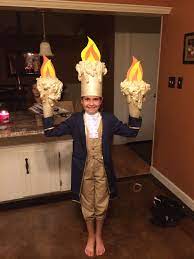 They used to be made ouf of cardboard tubes and a couple gold ceiling medallions and the fire kit. The Costume We Made For My Cayli S Debut Of Lumiere In Her School Play Beauty The Beast She S G Beauty And The Beast Costume Beast Costume Disney Costumes