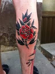 Black And Red Rose Tattoo For Women Old School Rose Tattoo Traditional Style Black And Red Rose Tattoo On The Calf Traditional Rose Tattoos Traditional Tattoo Rose Tattoos