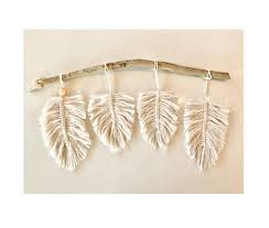 If you've gotten into making macrame or you just love the look of it, you're loop a small key chain through the top of your macrame and attach the key chain to a nail or push pin to hang it up on your wall.1 x research. Macrame Feather Wall Hanging On Driftwood Felt