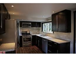 Galleys are typically narrow but in a larger room, an island gives a stopping point in the middle for families to sit at. Great Ideas For Remodeling A Mobile Home Manufactured Home Remodel Mobile Home Renovations Mobile Home Makeovers