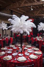 Set out a candy buffet and display vibrant gumballs, mini funnel cakes and colorfully spun cotton candy. A 1920s Speak Easy Corporate Dinner Casino Party Decorations Feather Centerpieces Casino Theme Parties